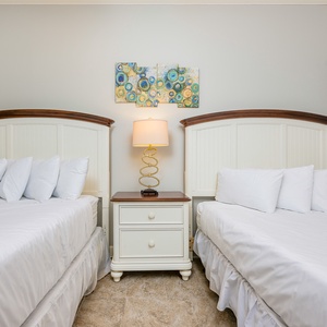 Rest and recharge in this cozy guest bedroom, where soft beds invite peaceful nights after beach adventures