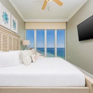 Wake to a breathtaking sunrise in this king guest suite with stunning beach views from the windows