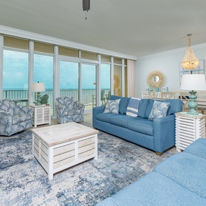 Gather in this welcoming living space and enjoy stunning beach views through the windows