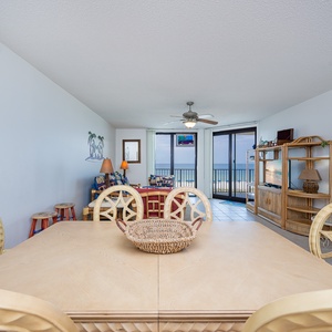 Dine at the spacious table while enjoying views of the beach through large sliding glass doors