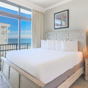 Drift into restful nights on the plush king bed in this guest suite, with refreshing balcony views