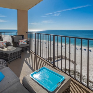 Relax on the balcony with cozy seating, a beach view, and a perfect spot for morning coffee or evening sunsets