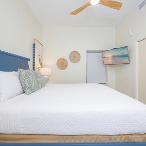 Enjoy restful nights in this inviting bedroom with a king bed and a mounted TV for your entertainment