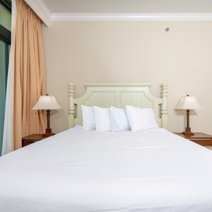 Awake refreshed in this queen guest suite, savoring stunning coastal views from your balcony
