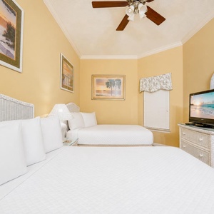 Experience restful nights in this cozy guest bedroom, where soft bedding and inviting decor enhance your beach escape
