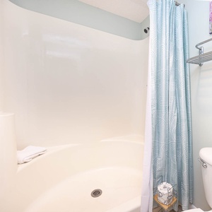 Refresh in the master bathroom featuring a walk-in shower and soft towels for your comfort during your stay