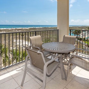 Balcony seating offers a perfect spot to enjoy views of the beach and the inviting pool area below