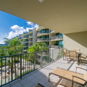 Relax on the spacious balcony, soaking in the gentle breeze and lush garden views