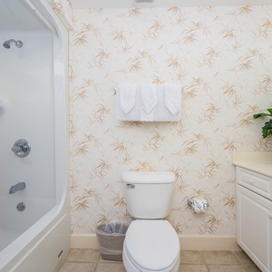 Enjoy a relaxing shower after a day of adventure in this guest bath with stylish accents and fluffy towels