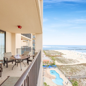 Enjoy your morning coffee on the balcony, overlooking the beach and a sparkling pool area below