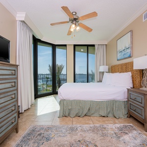 Take in the stunning bay views streaming through the balcony doors in this queen guest suite