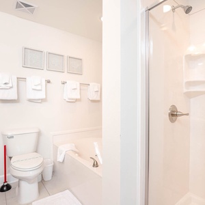 Unwind in the master bathroom featuring a relaxing jetted tub and soothing shower for your spa-like retreat