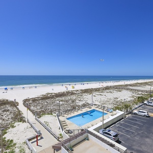 Enjoy stunning beachfront views with a relaxing pool area just steps away, perfect for your getaway