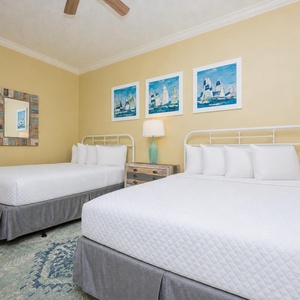 Relax on one of the cozy queen beds in this guest suite and enjoy a peaceful slumber