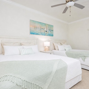 Rest peacefully in this serene guest room featuring two comfortable queen beds with soft linens