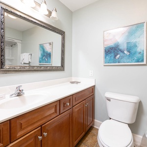 Refresh and rejuvenate in this guest bath, illuminated by natural light in your coastal retreat