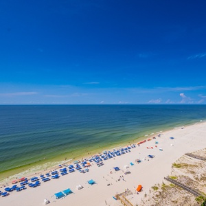 Experience seemingly endless coastline views of the horizon as waves lap the shore and the sun glistens over the water