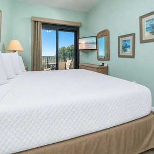 Sink into the soft king bed, enjoying coastal views from your window while planning your next beach day