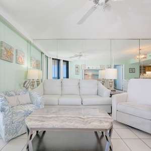 Soft armchairs and a plush sofa with a queen sleeper welcome you to unwind after a day along the coast