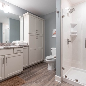 Experience the rain showerhead in this guest bath for a refreshing retreat