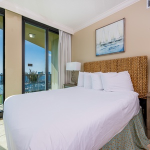 Awaken refreshed in a soft queen bed, embraced by natural light and bay views that invite peaceful mornings