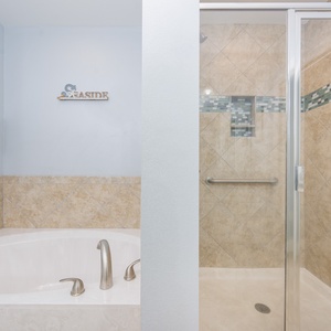 Indulge in relaxation in the master bath with a refreshing walk-in shower and soothing tub