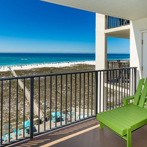 Relax on your balcony lounger, soaking in the beach vibes and stunning coastal views as you unwind in comfort
