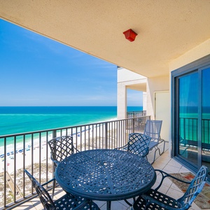 Enjoy meals or drinks on the balcony while taking in the expansive views of the shoreline and water