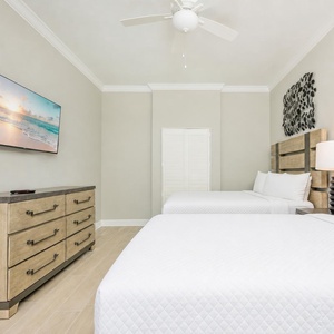 Enjoy a good movie in one of the two queen beds for a peaceful retreat
