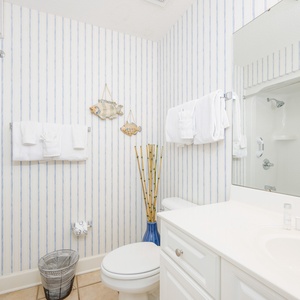 Freshen up in this guest bath in the relaxing shower or soothing tub before an exciting day