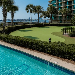 Discover the putting green surrounded by coastal landscaping and the lazy river during your stay at Phoenix on the Bay