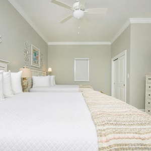 Relax with your favorite show for a peaceful night on the beach in this queen guest bedroom