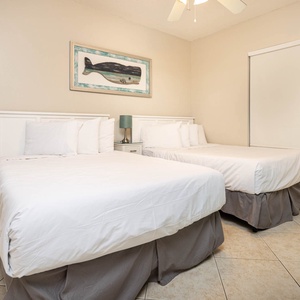 Rest comfortably in this inviting guest room with two double beds, tasteful decor, and a relaxing atmosphere for your stay