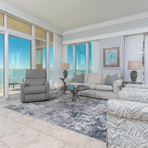 Relax in the inviting living area with plush seating, queen sofa sleeper, and stunning beachfront views