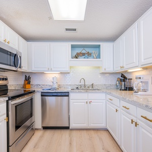 Soft overhead light brightens your kitchen while you prepare fresh meals with gleaming appliances nearby