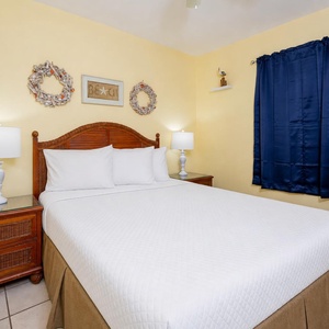 Relax on the plush king in the bedroom as you recharge for a day of fun along the coast in this welcoming suite
