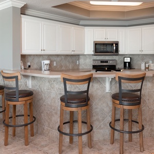 Wake up with morning coffee at the breakfast bar and get ready for a beach day in this stylish space