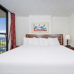 Relax in this king suite with soft linens and natural lighting from the balcony