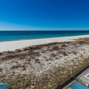 Gaze at the stunning coastline from your outdoor space, where relaxation meets breathtaking views of the water