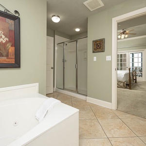 Indulge in relaxation in the master bath with a refreshing walk-in shower and soothing jetted tub