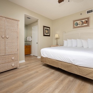 Relax in the spacious master bedroom featuring a king bed, stylish decor, and access to the master bath