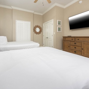 Experience restful nights in this guest bedroom, featuring two queen beds and stream your favorite shows