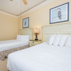 Feel the inviting vibe in this guest bedroom, designed for restful nights with a double and a queen bed