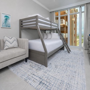 Charming bunk room with coastal views and a twin over full bunk bed, perfect for kids