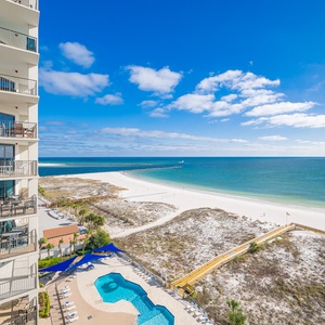 Inviting pool area and stunning views of the tranquil waters and beach from your balcony