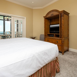 Relax after a fun beach day and enjoy a movie from the cozy king bed in the master suite