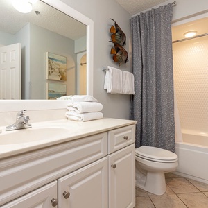 Refresh in the guest bathroom featuring a spacious vanity, soft towels, and a shower/tub combination for your convenience