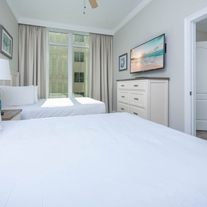 Unwind in this queen guest suite and stream your favorite shows or enjoy a good movie after a beach day