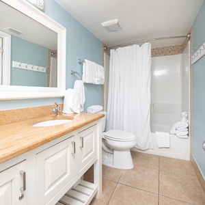 Master bathroom featuring a spacious vanity, modern fixtures, and a relaxing tub/shower combo for your comfort