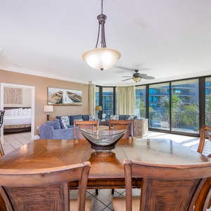 Gather around the dining table, sharing laughter and stories while enjoying the gentle breeze from the balcony